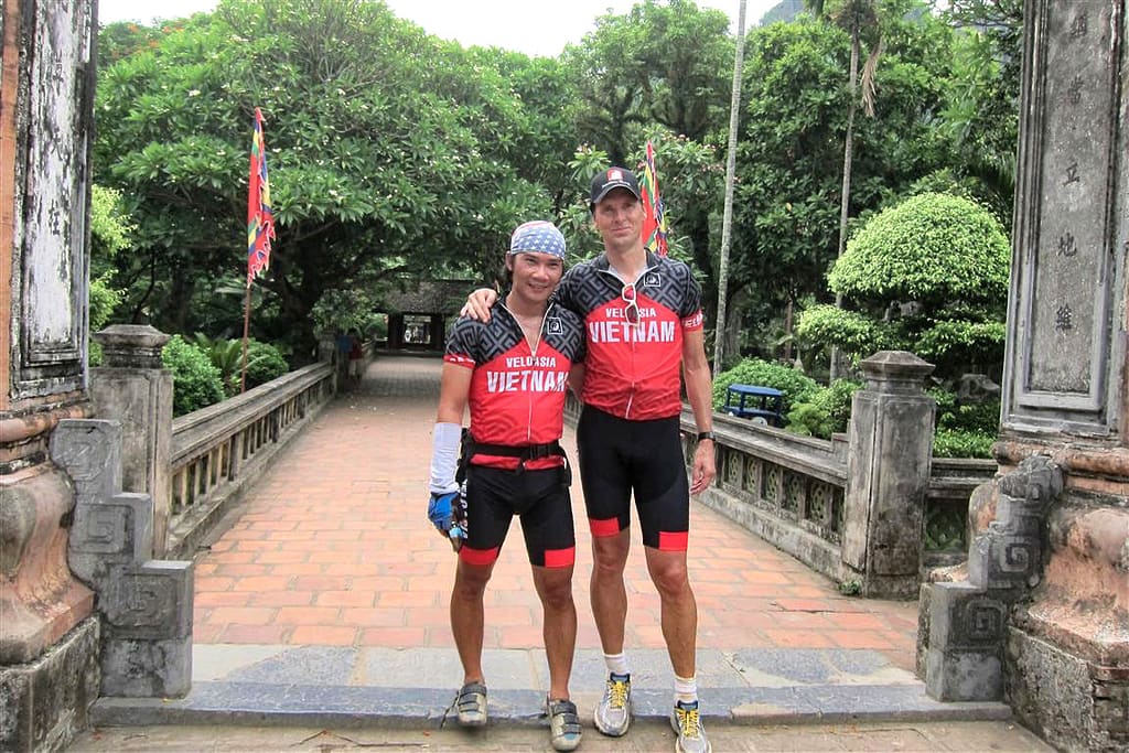 bicyclists visiting temple near Ninh Binh in Vietnam
